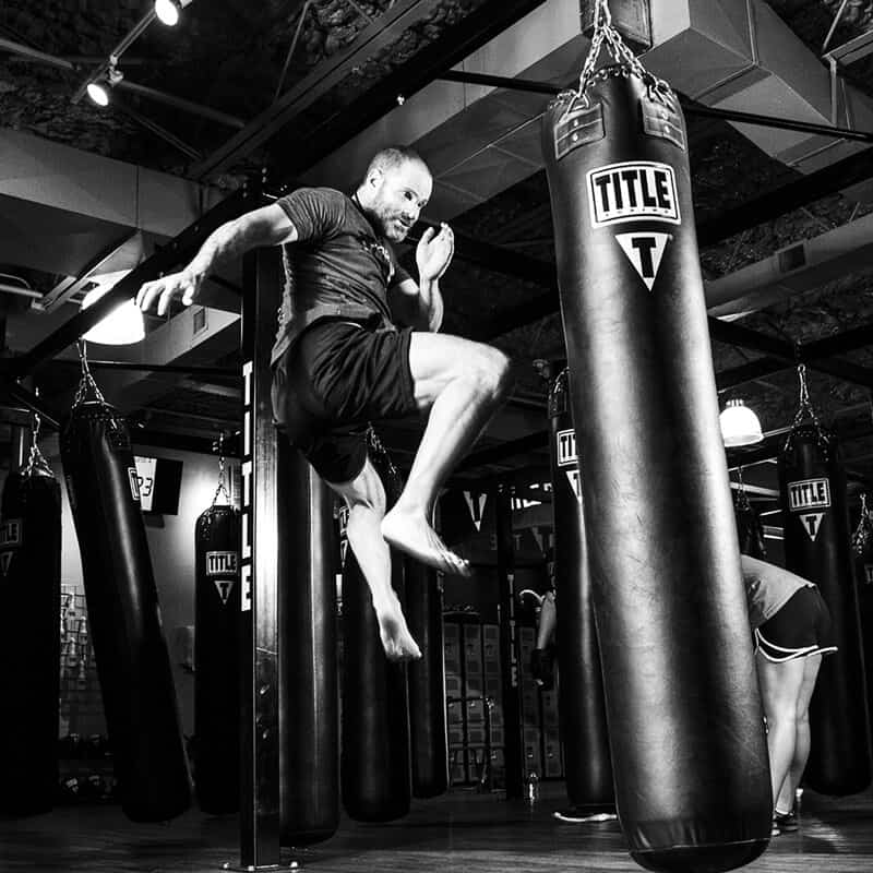Mixed Martial Arts Lessons for Adults in __CITY__ __STATE__ - Flying Knee Black and White MMA